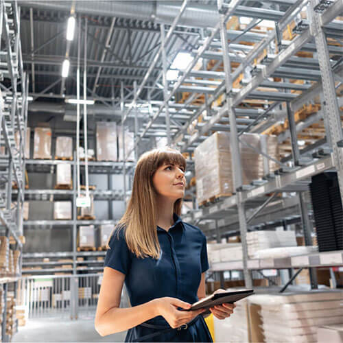Woman Standing In Warehouse